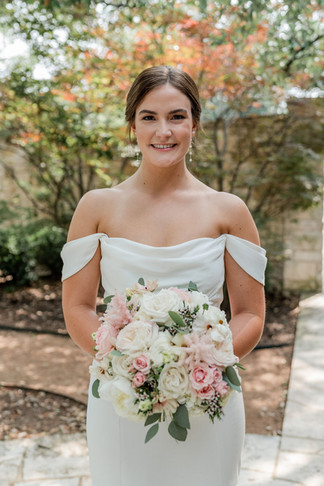 wedding at cathedral oaks bridal portrait with blush cream and sage green flowers