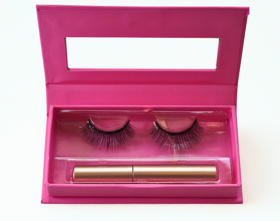 Eye-level view of a stylish makeup setup featuring magnetic lashes