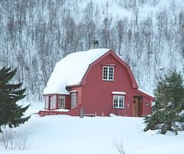 a red house in the middle of a snowy for