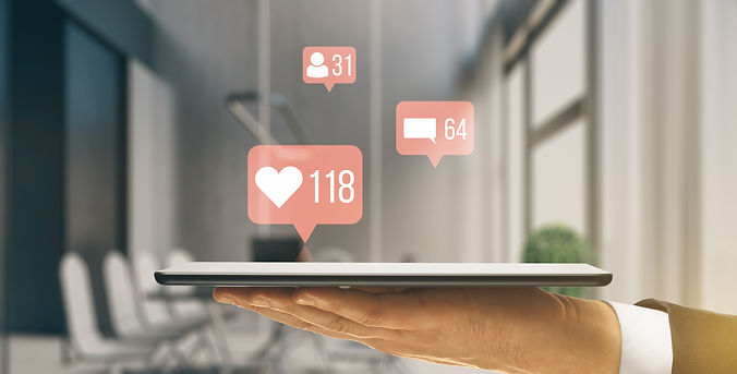 close-up-businessman-hand-holding-smartphone-with-creative-social-media-icons-hologram-blu