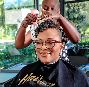 Certified Sisterlocks Consultant installing Sisterlocks on natural hair