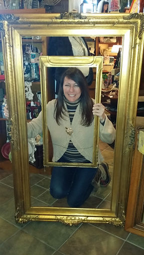 Karen with two large gold frames 122011