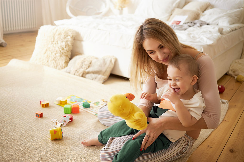 pretty-sister-spending-time-with-her-baby-brother-sitting-floor-bedroom-beautiful-young-ba