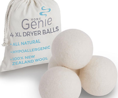 Owner placing HOME GENIE wool dryer balls into washing machine to reduce pet hair.