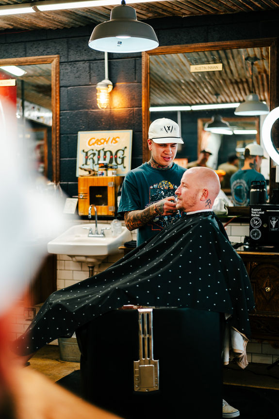 Man getting haircut at Washington Park Barber in Winston-Salem, North Carolina.