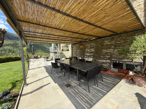 Outdoor dining under our pergola