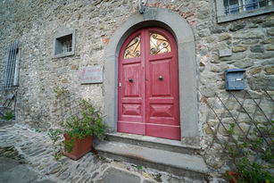 Bright Red Front door to Spino Secco