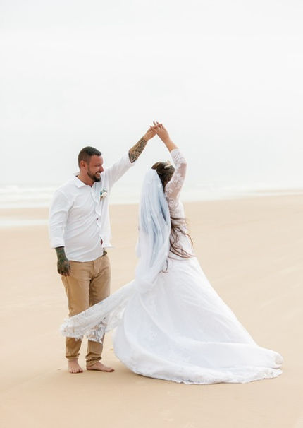 Couple dancing on the beach after they eloped on Moreton Island