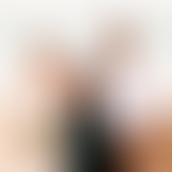 A wedding couple standing with their celebrant Kerri Watkins at Honeymoon Bay on Moreton Island