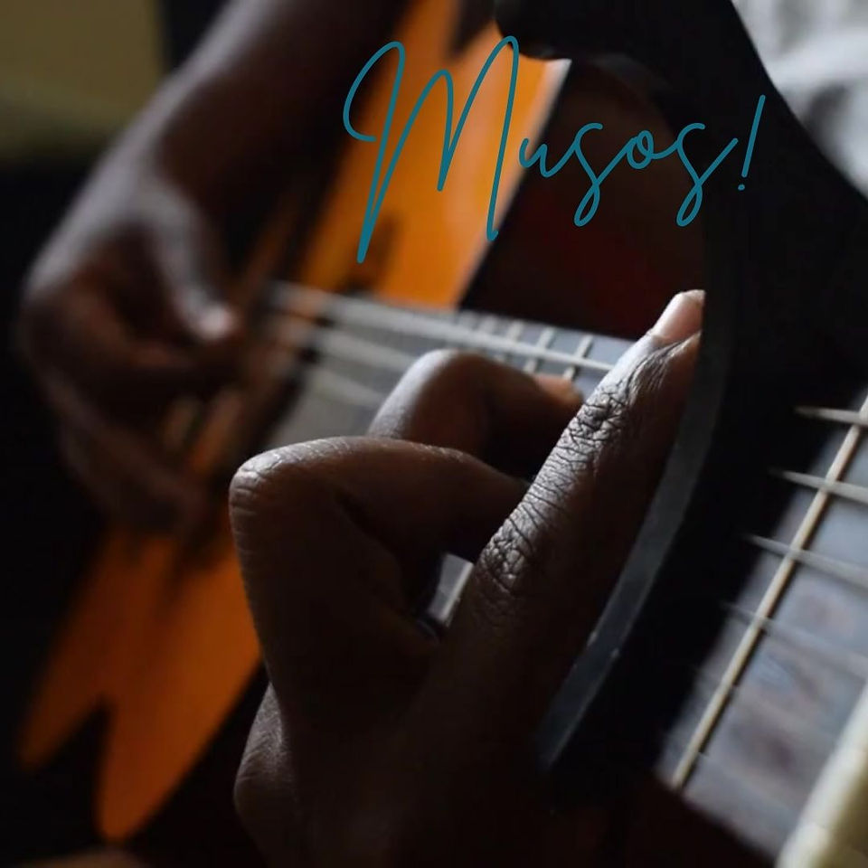 A man playing a guitar for wedding music