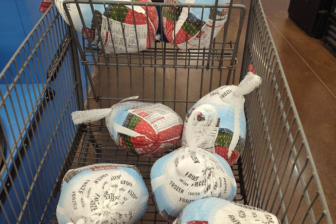 Shopping cart full of frozen turkeys