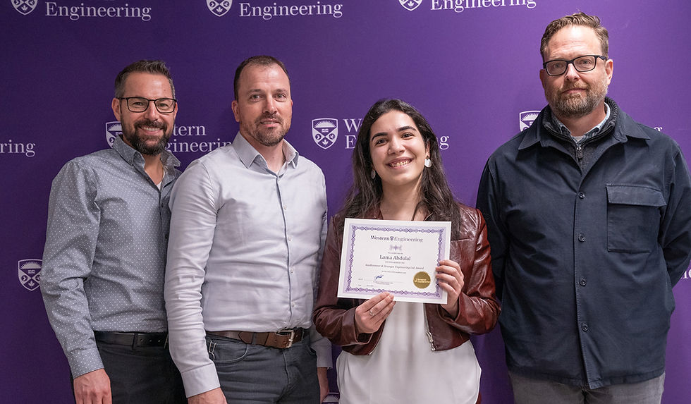Award recipient in front of Western Engineering backdrop