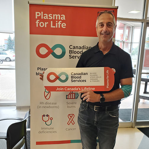 Engineer donating plasma at clinic