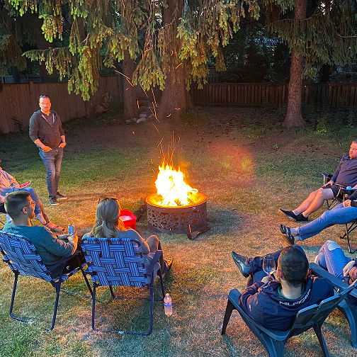 Campfire gathering at night