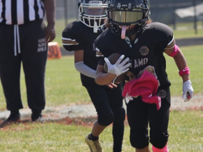 Skylar Dixon carries the football downfield, competing with confidence as a running back.