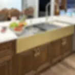 custom-60-inch-stainless-dual -tier-workstation-sink-brass-apron-rachiele.webp