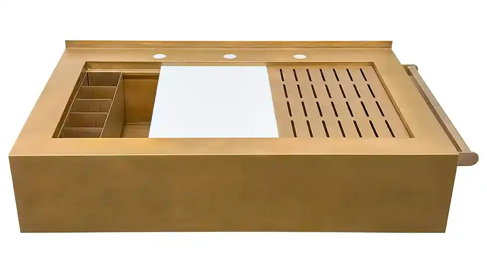 Front view of bronze custom Rachiele® sink with white HDPE cutting board and corner-mounted multi-use grid