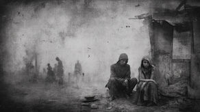 Young man and a woman sitting in a war-devastated village with an empty bowl.