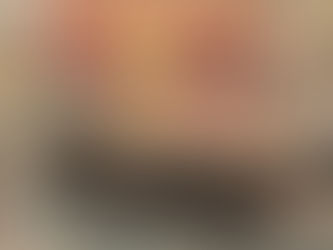 Old rowboat in drying lake as sun sets.