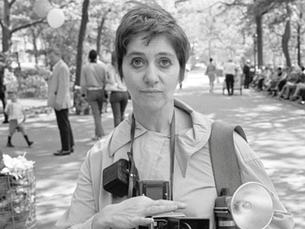 Diane Arbus with a camera in the park.