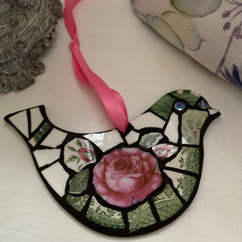 Pink and green ceramic bird mosaic