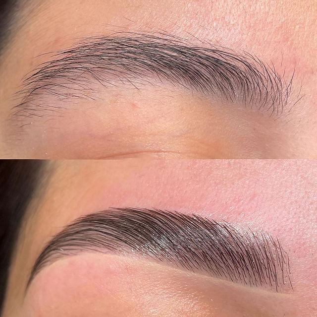 A skilled technician performing eyebrow threading, a precise and ancient technique for shaping eyebrows, at Lavoom Salon.