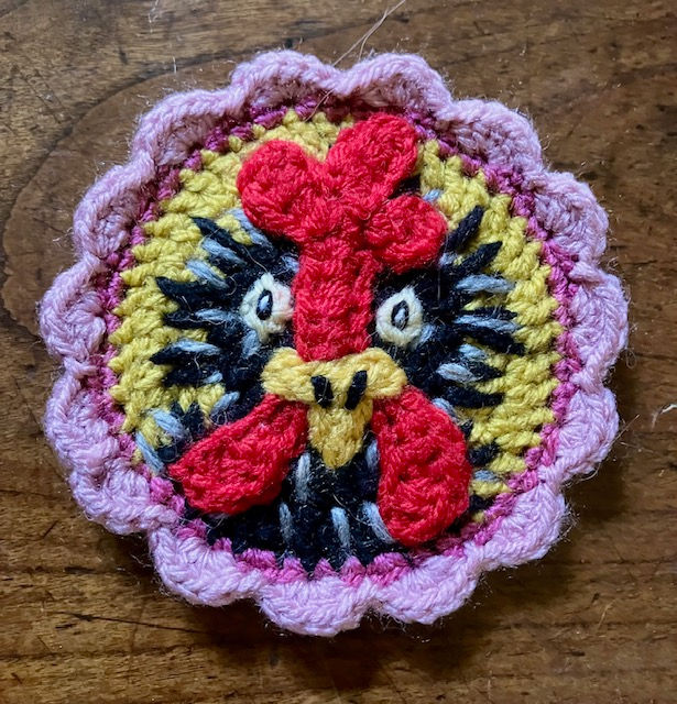 Crocheted chicken magnet front view