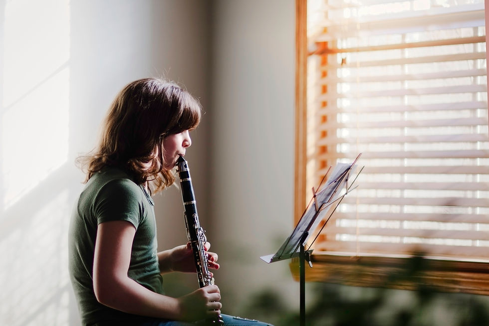 girl practicing the clarinet