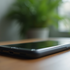     A smartphone on a wooden table illustrating vishing scam awareness