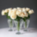 white roses in expensive crystal vases with faded edges on transparent background_.jpg