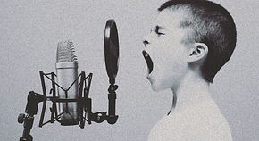 boy singing on microphone with pop filter_edited.jpg