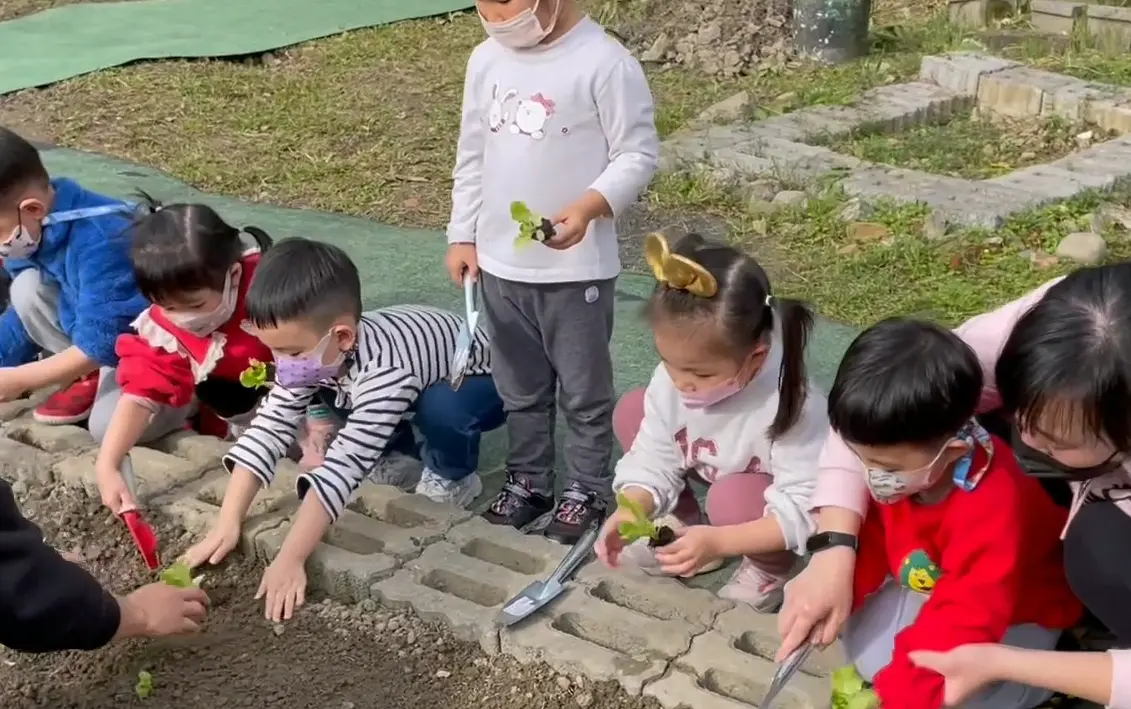 students in campus garden