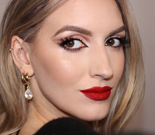 makeup with a red lip and strong eyes 