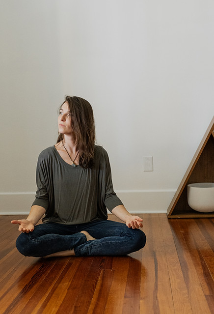 Woman sitting in meditation building self-confidence — self-esteem counseling in St. Petersburg, FL