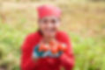Lady with home garden produce.