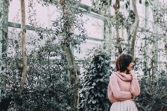 Woman in a Greenhouse