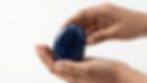 Numerologist in Chandigarh holding a blue healing stone