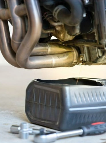drain-old-oil-from-engine-through-drain-plug-changing-oil-motorcycle-engine_77569-140_edited.jpg