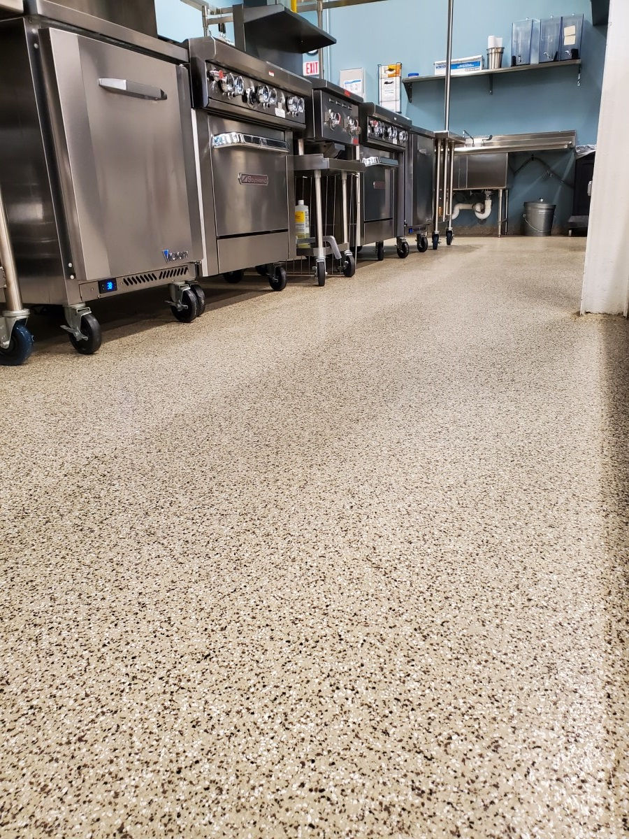 Commercial kitchen floor protected with seamless polyurea concrete coating system by Armor Shield Concrete Coatings.