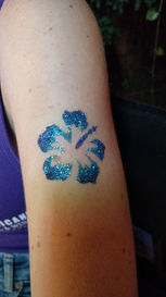hibicus-glittertattoo-kmfentertainment-facepaint-jupiter-palmcity-pbg-tequesta-tattoo.jpg