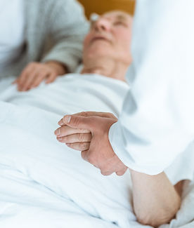 cropped-view-of-doctor-standing-near-patient-in-co-2023-11-27-05-20-43-utc.jpg