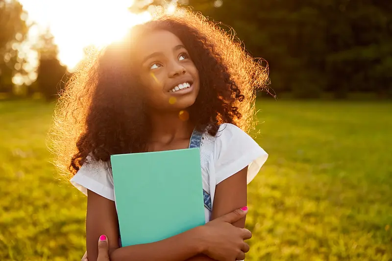 black-schoolgirl-with-notebook-in-park-2026-03-25-00-56-35-utc_converted.webp