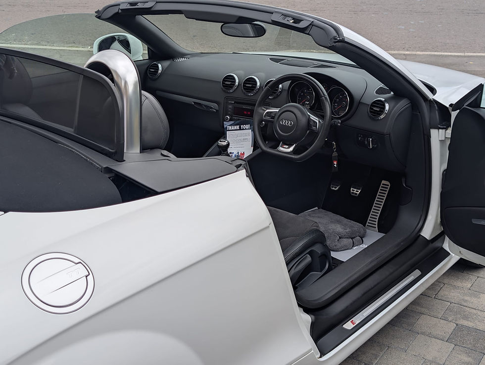Eye-level view of a clean car interior dashboard and seats