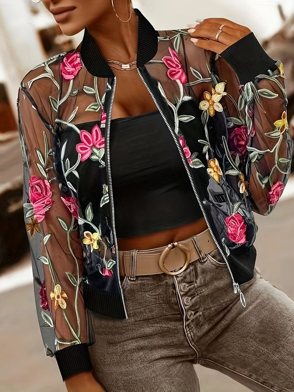 Miniaturbild: Side angle showing sleeve embroidery and zip closure