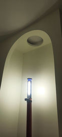 curved archway with circular opening above made with drywall