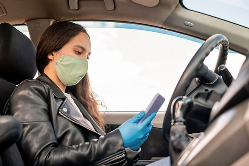 female-taxi-driver-using-smartphone-2021-09-24-02-52-53-utc.jpg