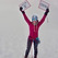 A women wearing a red jacket at the summt of chimborazo, holding two signs above her head