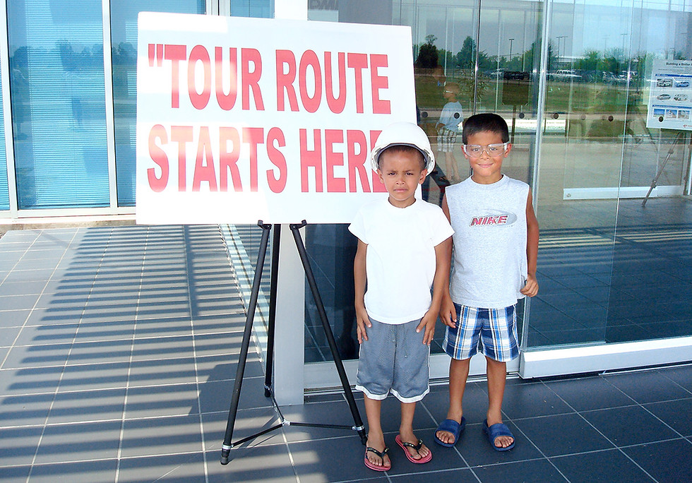 Coworkers playing tug‑of‑war during an outdoor Picnic Master company event.