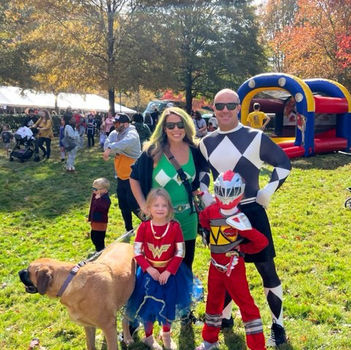 Family dressed in costumes at a Picnic Master company picnic.