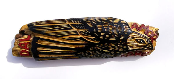 bird carving on driftwood
